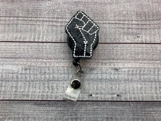 Black Fist Badge Reel